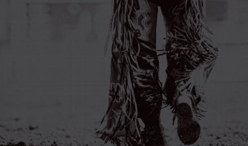 stylized image of man from waist down wearing fringed rawhide pants
